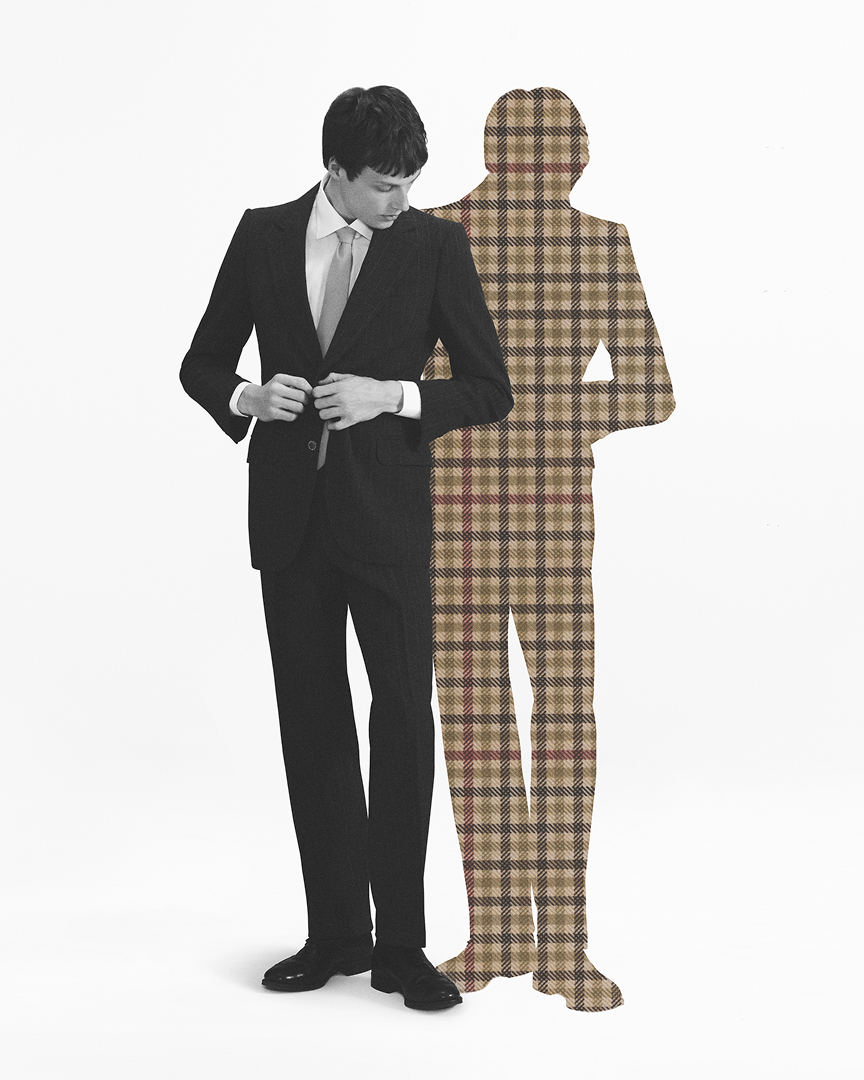 Man posing in tailored suit with herringbone shadow