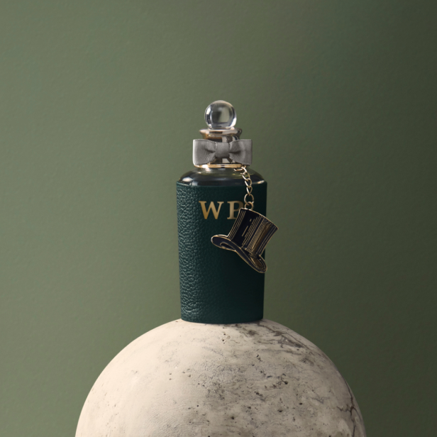 Green leather sleeve with gold monogram