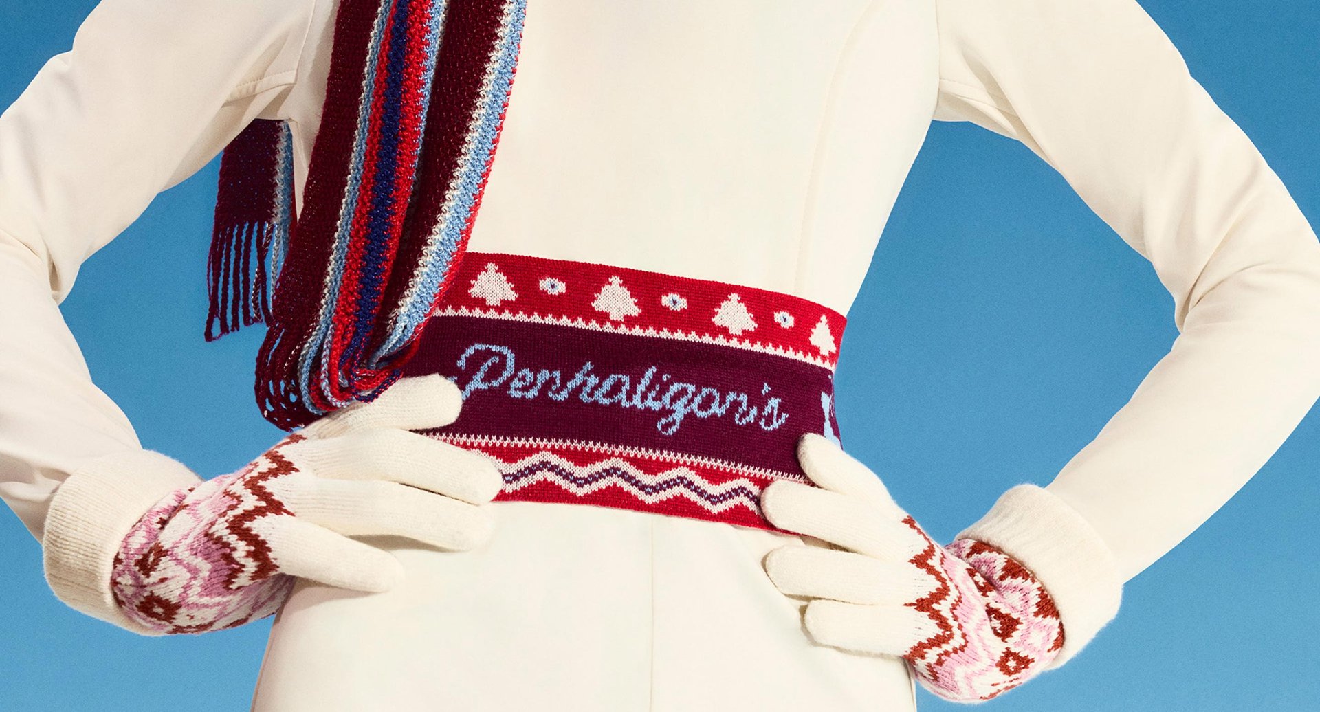 Woman in ski suit wearing knitted Penhaligon's badge