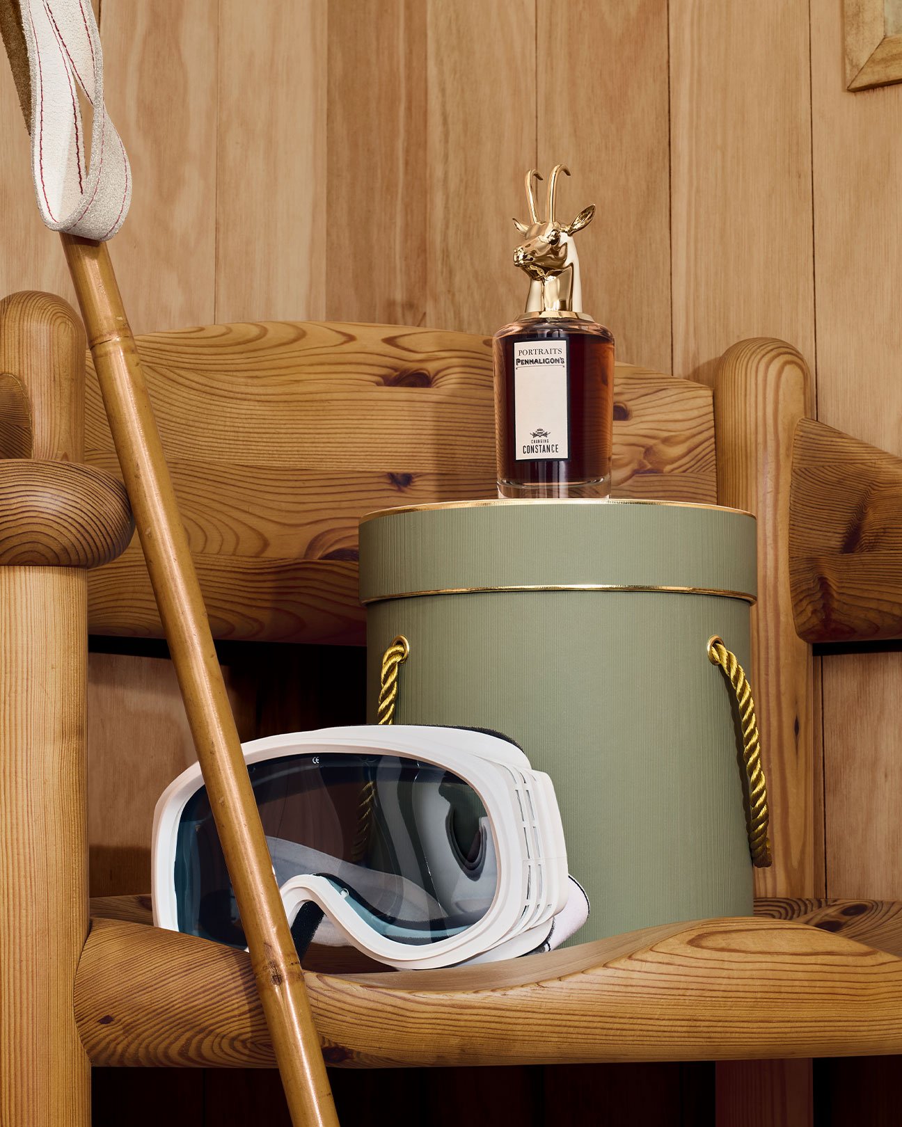 Lord George on Penhaligon's gift box and ski googles on wooden chair
