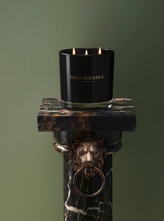 Maduro Leaf Candle on black marble stand