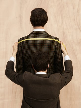 Man measuring tailored suit