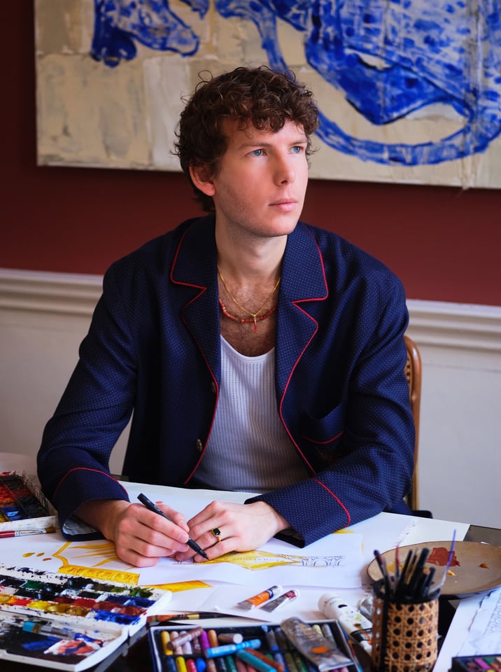 Gergei Erdei painting at desk